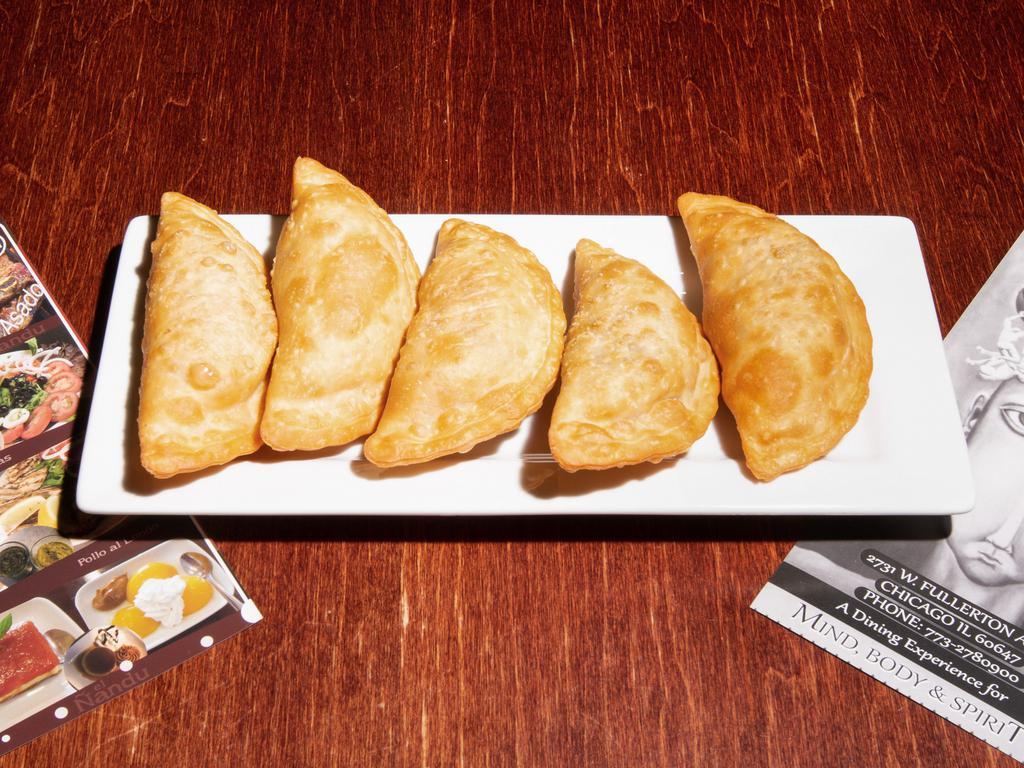 Pollo Empanada · Stuffed with tasty chicken, red bell peppers and green onions.