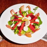 El Nandu Salad · This popular house delight is made fresh with palm hearts, beats, red bell pepper, and juicy...