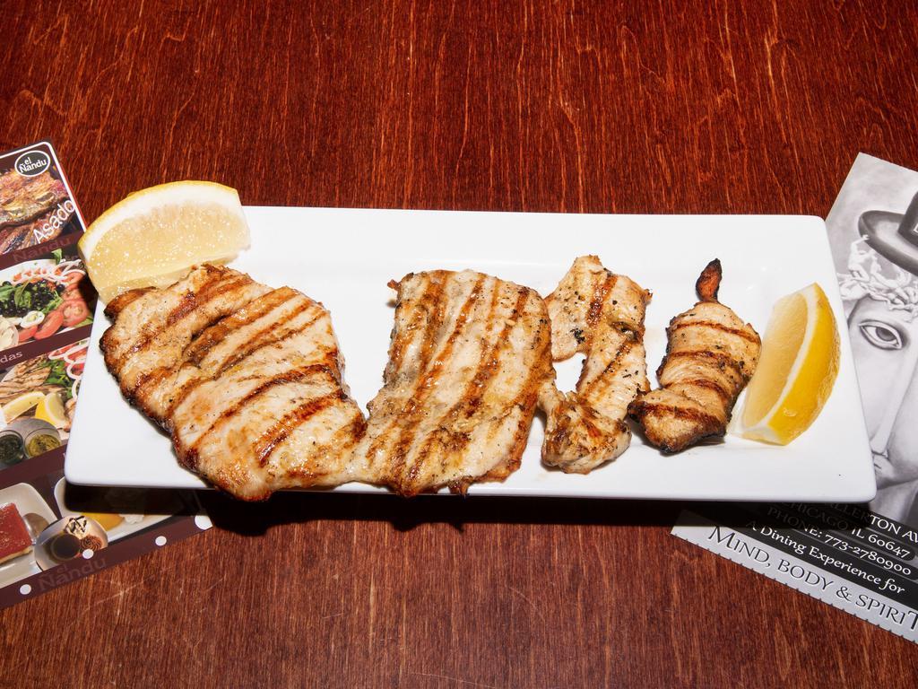 Pollo al Limon · The lightest entree on our menu. A grilled, skinless, boneless breast of chicken, lightly basted with lemon juice. Perfect for the health-conscious!