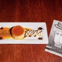 Flan con Dulce de Leche · A traditional homemade Argentine custard topped with a kiss of whipped cream and imported Ar...