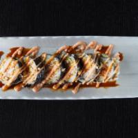 Vegas Roll · Whole roll. 6 pieces. Deep-fried roll with imitation crab and avocado inside. Topped with sp...