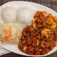 General Tao Chicken Wok · Served with steamed rice and salad.