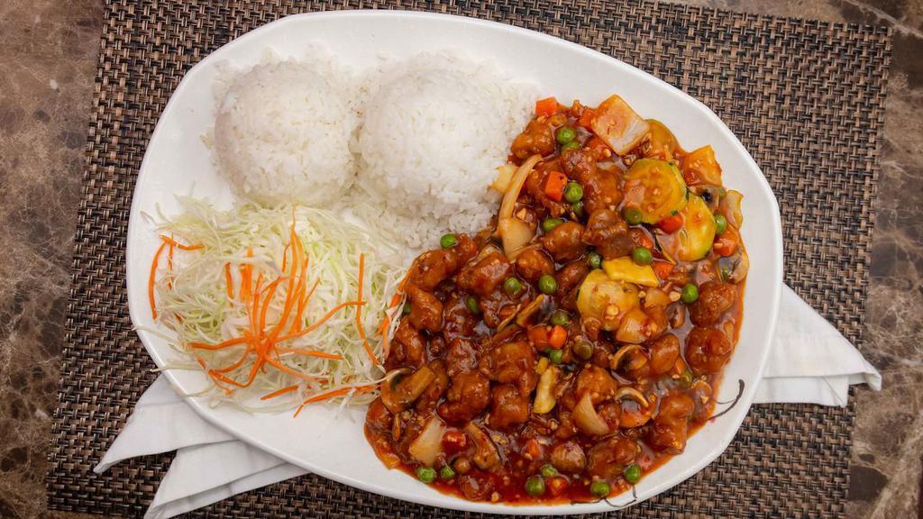 General Tao Chicken Wok · Served with steamed rice and salad.