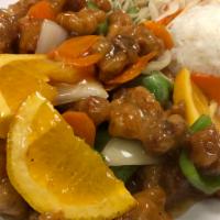 Orange Chicken Wok · Served with steamed rice and salad.