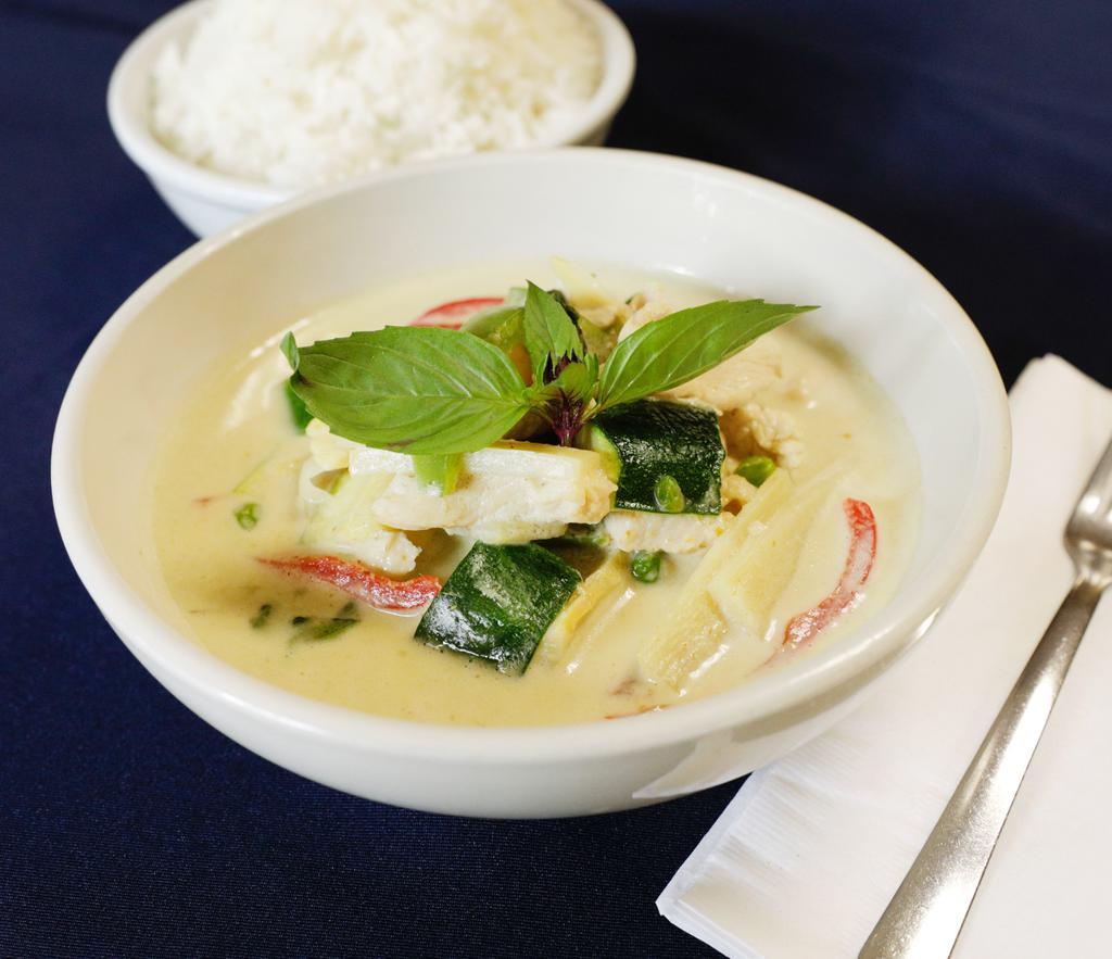28. Gang Keow Wan · Medium spicy green curry with coconut milk, bamboo shoots, bell peppers, peas, zucchini, Thai basil and kaffir lime leaf. Includes rice.