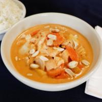 31. Gang Massaman · Medium spicy massaman curry with tamarind juice coconut milk, potatoes, carrots, onion and p...