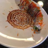 4 Season Roll · Eel and avocado topped with crab salad, tuna, avocado, spicy sauce, wasabi sauce, tobiko and...