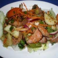 Spicy Beef Salad · Grilled slice beef, tomatoes, cucumbers, carrot, red onion, mixed with spicy lime dressing b...