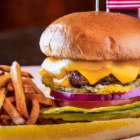 1/2 lb. Beef Burger · Lettuce, tomato, red onion, pickle, cheese, bun, fries.