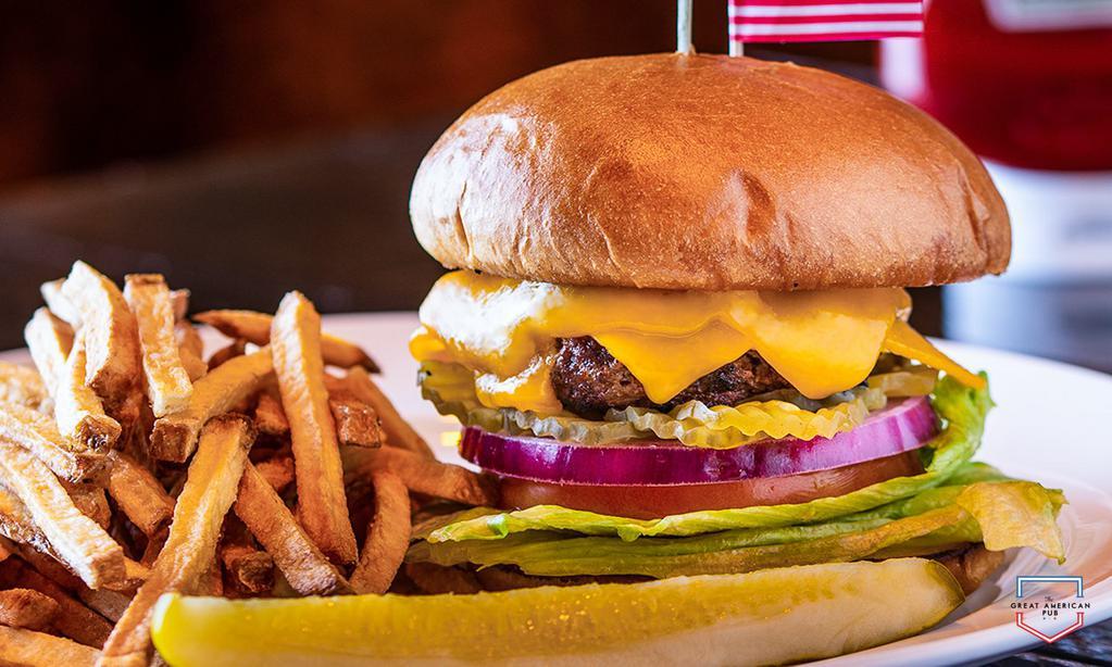 1/2 lb. Beef Burger · Lettuce, tomato, red onion, pickle, cheese, bun, fries.