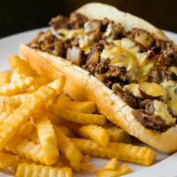 Philly Cheese Steak Sandwich · Sliced beef, homemade cheese sauce, onions, crusty roll, fries.