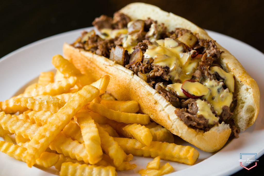 Philly Cheese Steak Sandwich · Sliced beef, homemade cheese sauce, onions, crusty roll, fries.