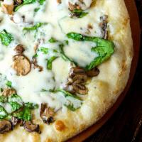 Spinach and Mushroom Pizza · Spinach, mushroom, roasted garlic, mozzarella, white sauce.
