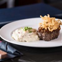 Prime Flat Iron · Bleu cheese crust and garlic fries.