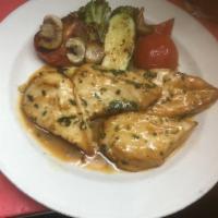 D Pollo al Ajillo · Chicken breast in garlic white wine sauce, Served with grilled vegetables and rice.
