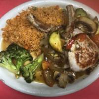D Chuleta 5 Burro · Tasty pork chop served with sautéed vegetables and Mexican rice.