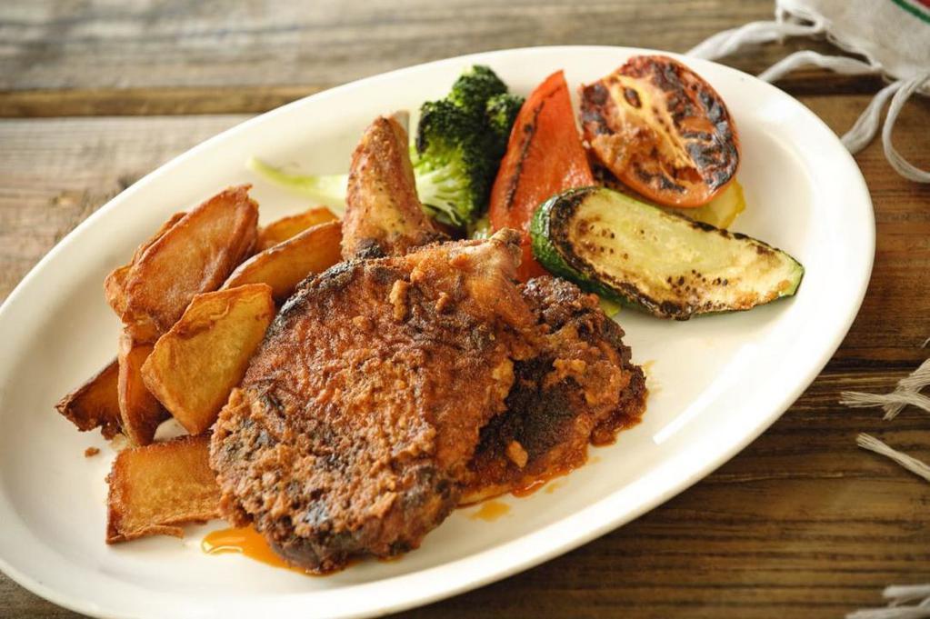 D Chipotle Chuleta · Chipotle breaded, slow baked pork chops served with Mexican fries and grilled vegetables (spicy)