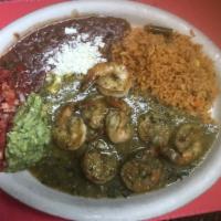 D Camarones Salsa Verde · Sautéed jumbo shrimp in a mildly spicy green sauce served with rice, beans, guacamole and pi...