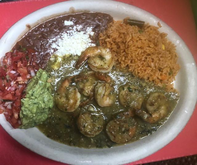D Camarones Salsa Verde · Sautéed jumbo shrimp in a mildly spicy green sauce served with rice, beans, guacamole and pico de gallo.