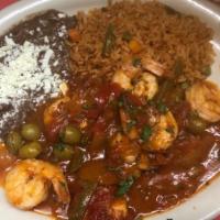 D Camarones Veracruz · Sautéed jumbo shrimp with tomatoes, onions, mixed peppers, olives and capers. Served with ri...