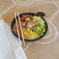 Teriyaki Chicken Bowl · White rice, chicken, unagi, edamame, bacon bits, fried onions, pineapple, corn, and sesame s...