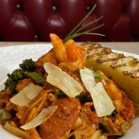 Jambalaya pasta · Fettuccini, sugo, chicken, shrimp, andouille sausage, onions,bell peppers, broccolini, cajun...
