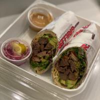 Steak Avocado Chipotle Wrap · Fresh grilled steak, mixed greens, tomato, red onion, avocado & chipotle sauce.