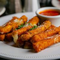 Mozzarella Fritti · Fresh-cut Wisconsin mozzarella, lightly breaded and fried to a golden brown. Served with Rus...