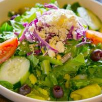 Greek Salad - Large · Garden-fresh vegetables, Kalamata olives, and fresh Romaine lettuce sprinkled with feta chee...
