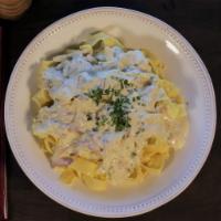 Pappardelle Carbonara Pasta · Pancetta, red onions, and homemade pappardelle pasta swirled in Russo’s homemade pecorino Ro...
