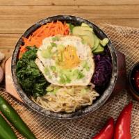 Hot Stone Bibimbap · Traditional Korean dolsot bowl in hot stone pot with veggies topped with egg or build your o...