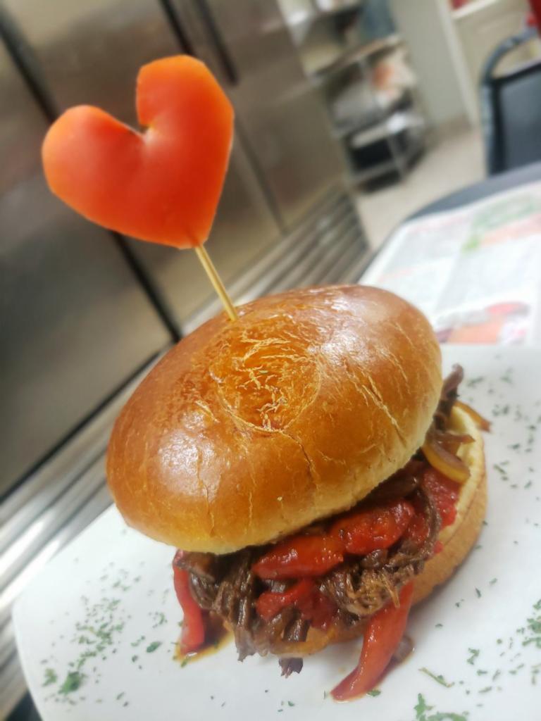 Beef Brisket Sandwich · Grilled onion, roasted red peppers and honey mustard sauce.
