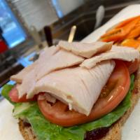 Carved Turkey Sandwich · Fresh Oven Roasted Turkey, Cheese, Honey Mustard, Cranberry Sauce, Carrot, Cucumber, Lettuce...
