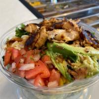 Spicy Fish Taco Salad · Romaine and red cabbage, tilapia, shredded mozzarella, avocado, fresh cilantro, corn and bla...
