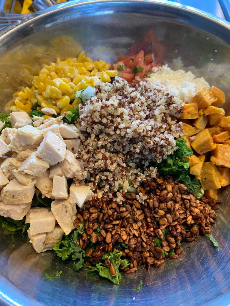 Quinoa and Kale Salad · Shredded kale, organic quinoa, mixed greens, grilled-chicken breast, sweet potatoes, corn, spiced sunflower-seeds, queso fresco, pico de gallo, chili citrus vinaigrette.