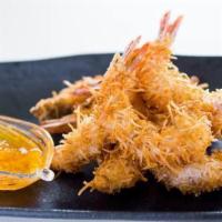 COCO SHRIMP · Delicious shrimp rolled in coconut flake and batter fried till golden brown. Served with swe...