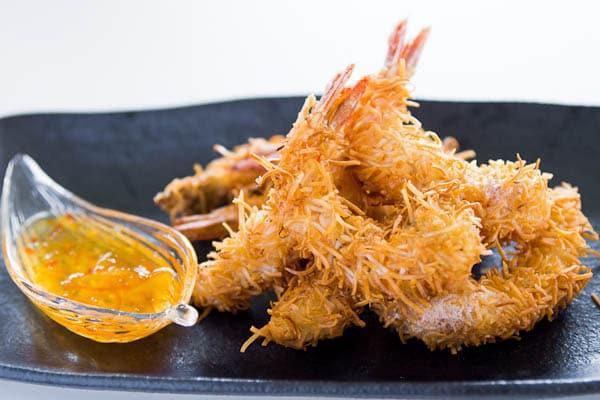 COCO SHRIMP · Delicious shrimp rolled in coconut flake and batter fried till golden brown. Served with sweet and sour plum sauce.