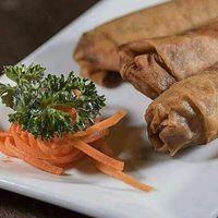 SHRIMP ROLLS · Marinated whole shrimp wrapped in a delicious crispy pastry shell, served with plum sauce.