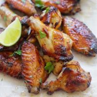 THAI CHICKEN WINGS · Marinated crispy chicken wings served with sweet chili sauce.