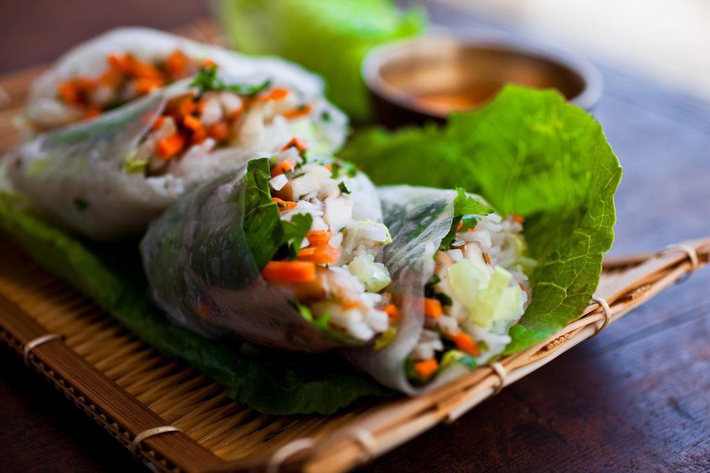 FRESH ROLLS · Lettuce, cucumbers, carrots, basil and cucumber wrapped in a thin rice noodle. Served with peanut tamarind sauce.