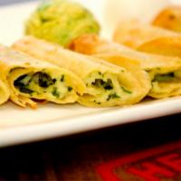 Cheese & Cilantro Taquitos · Served with sour cream, guacamole, and spicy salsa.