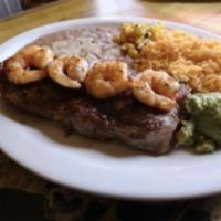 Carne Asada Speciality · New York steak served with rice, beans, and tortillas.