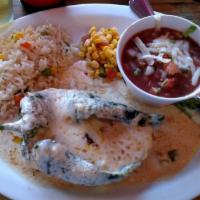 Chile Encuerado Speciality · 1 chile poblano filled with cheese and shrimp on a bed of white creamy sauce served with whi...