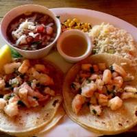 Shrimp Scampi Tacos Specialty · 2 shrimp tacos mix with garlic, lemon juice, and parsley.
