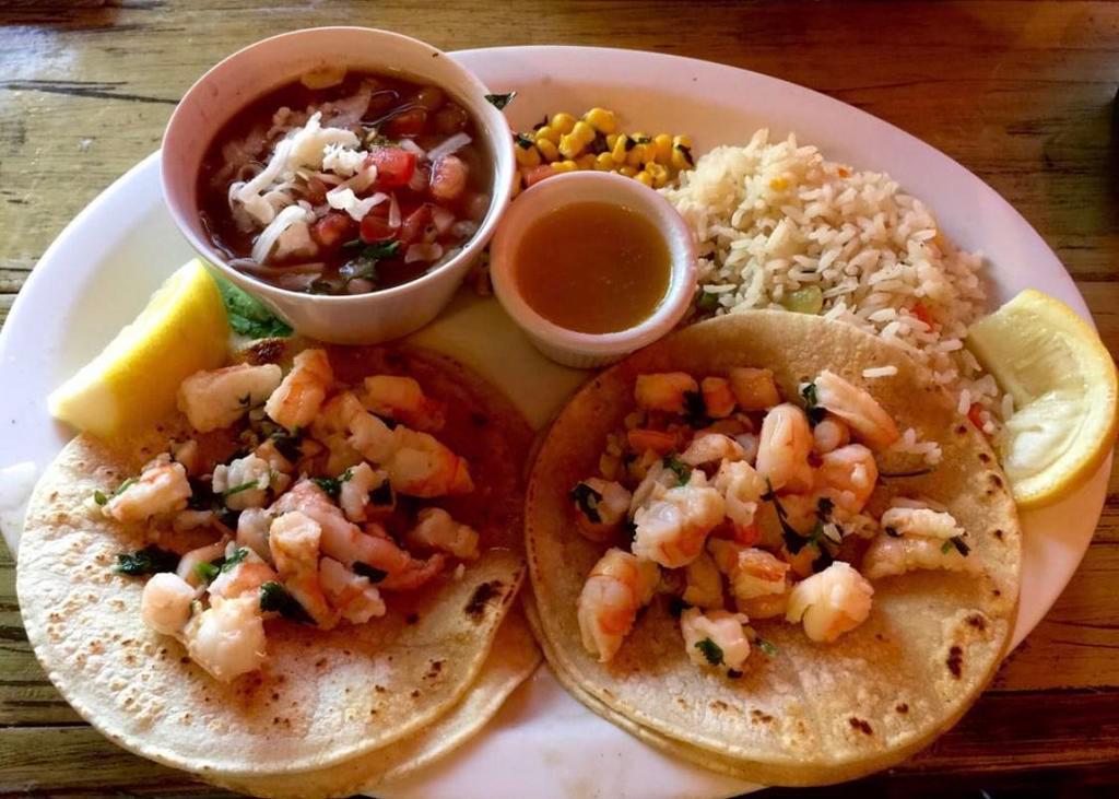 Shrimp Scampi Tacos Specialty · 2 shrimp tacos mix with garlic, lemon juice, and parsley.