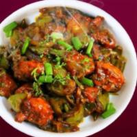 Chilli Chicken  · Deep fried chicken sauteed with onions, bell peppers and green chilies. Spicy.