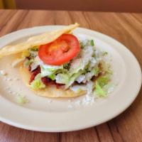 Tostadas · Comes with beans , lettuce ,sour cream , tomato , fresh cheese And choice of meat 