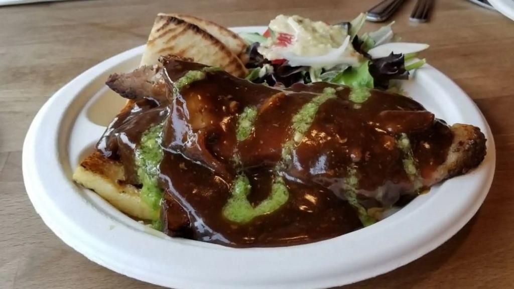 Brisket Gyro Plate · Slow-roasted beef brisket cooked with mushrooms onions house gravy topped with Swiss cheese over rice with side salad, hummus and pita bread .