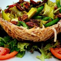 43. Bird's Nest · A fried taro-root bird's nest filled with a delectable combination of veggie-chicken and veg...