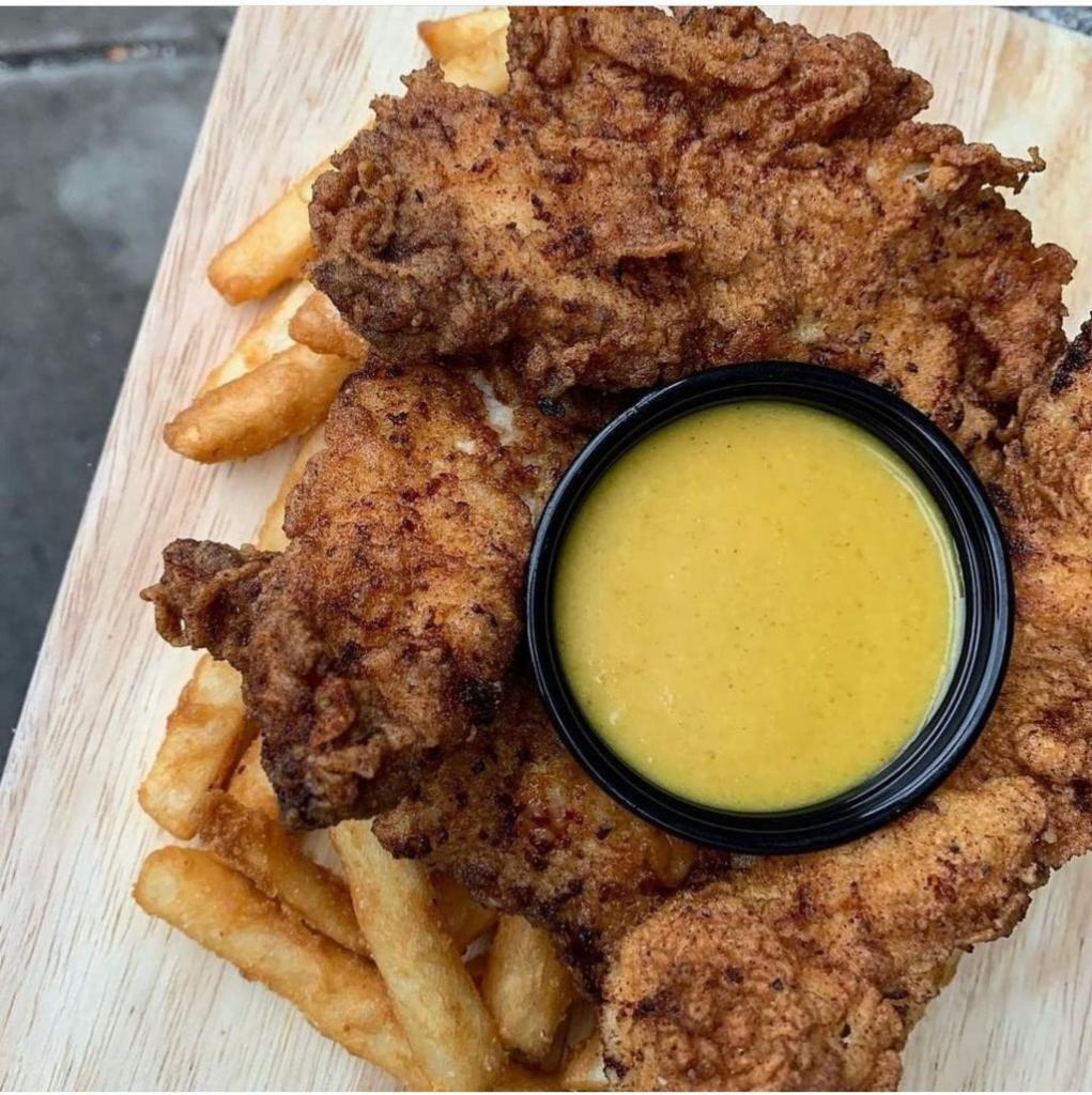 Buttermilk Chicken Tenders with Fries · Battered and fried chicken breast with a side of fries. Choice of sauce: Buffalo, honey chipotle, honey mustard.
